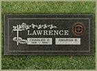 a flat rose-colored stone with name and date and flower etching
