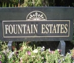 Large granite sign on two supporting granite footings with Fountain Estates' engraved in the face along wit sunburst-type logo above