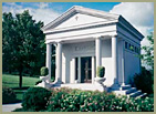 large white stone building with pillars